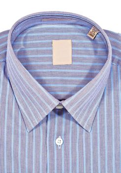 A folded pinstriped dress shirt