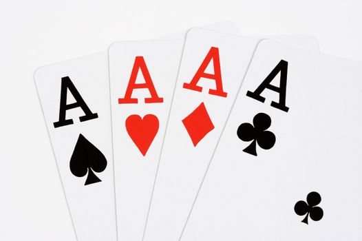 Four aces on white background