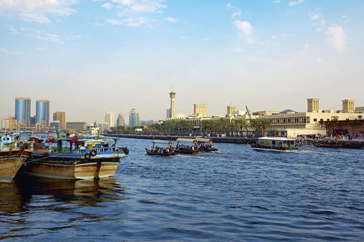 Water taxi crossing the river in the Creek , Dubai