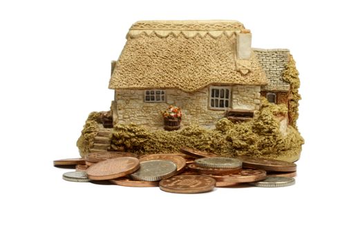 Coins and house mortgages savings deposit concept