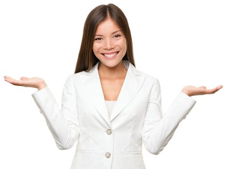 Showing business woman with empty copy space for two products with open hand palms. Businesswoman in white suit isolated on white background. Happy smiling multiracial Chinese Asian / Caucasian female model.