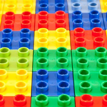 Background of plastic building blocks.  Bright colors.