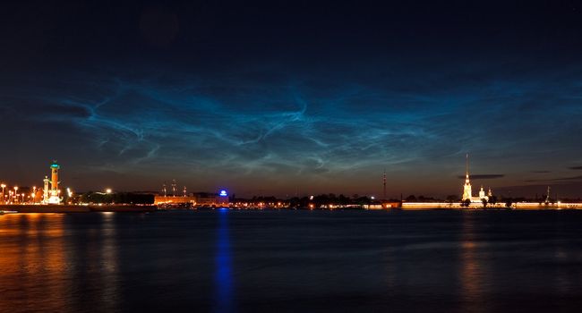 Colorful night sky over Saint Petersburg and Neva river