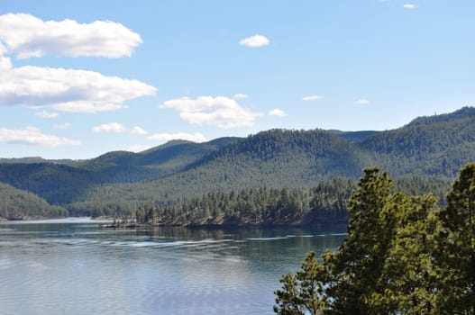 Black hills and water background