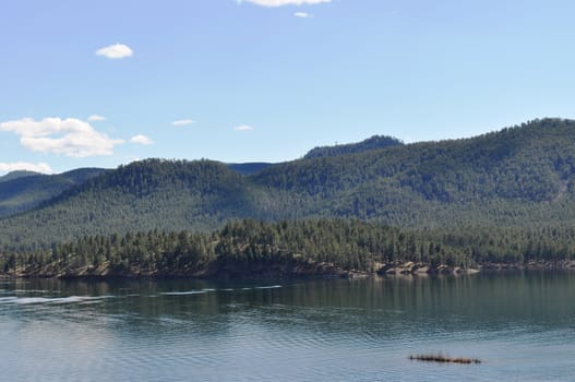 Black hills and water background