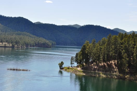 Black hills and water background