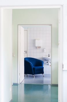 Shot of rest room in hospital, blue armchair