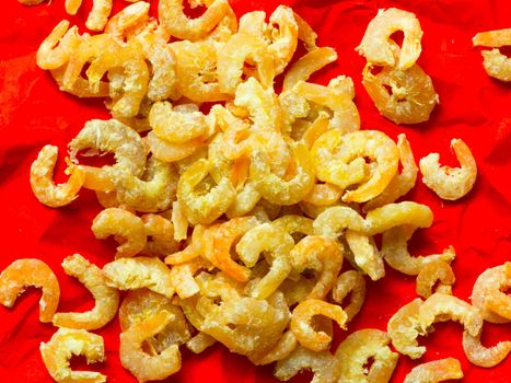 close up of dried shrimps on red wrapping paper