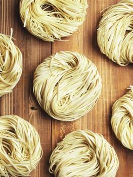 close up of asian dried egg noodles on kitchen table