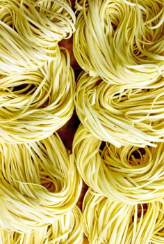 close up of a heap of asian dried egg noodles