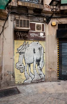 The gate with city graffiti. Barcelona, Spaine