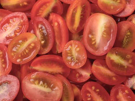 close up of a heap of sliced cherry tomatoes