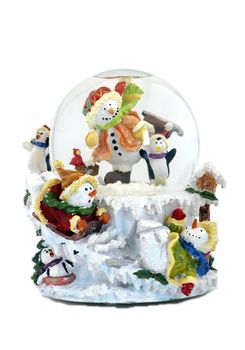 Musical snowglobe with snowmen and penguins enjoying winter.