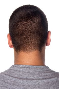 A closeup of the back of a young mans head and neck isolated over a white background.