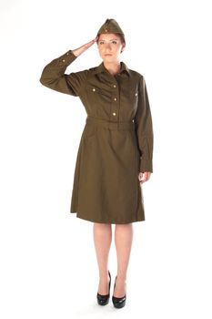 The young and beautiful girl in a military dress and a field cap