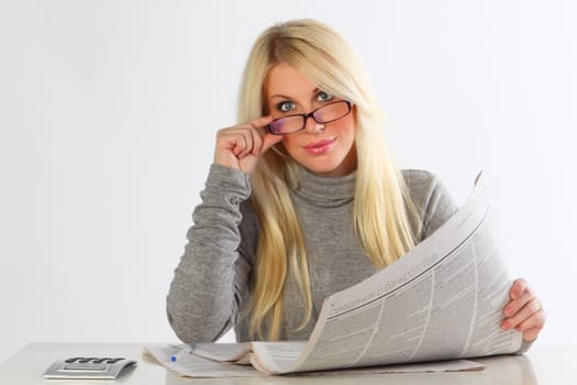 The business woman with newspapers And with the calculator