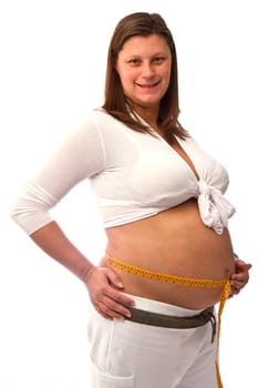 Pregnant woman measures her belly 