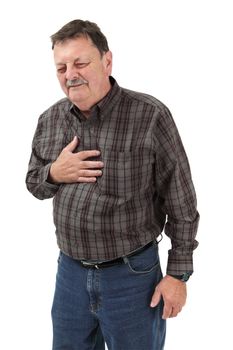 Photo of a man in his sixties suffering pain from a heart attack or severe indigestion.