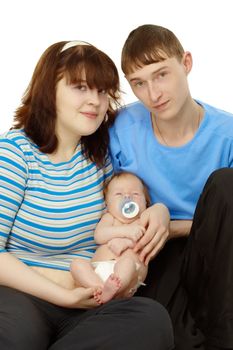 Portrait of a young family - dad, mom and baby