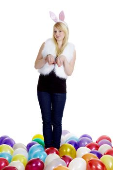 girl dressed as a rabbit and balloons on a white background
