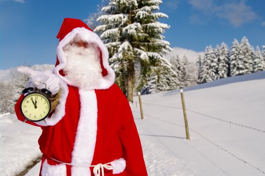 Santa Claus, Father Christmas holds watch clock