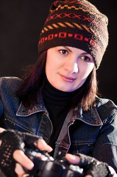 woman gamer with joystick  on darken background