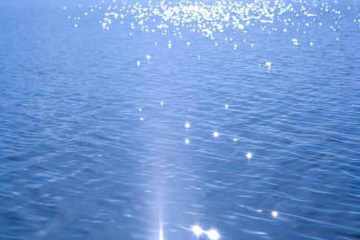 bright white sun flares on the water