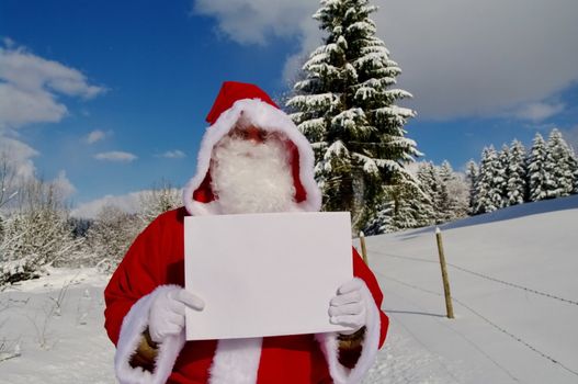 Santa Claus, Father Christmas holding blank sign