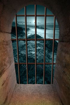 View on moonlit coast from a dangeon window