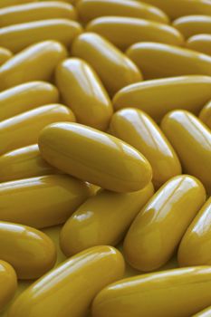several yellow tablets vertical photo