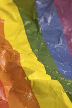 wrinkled gay flag vertical photo