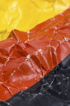 wrinkled german flag detail vertical photo,