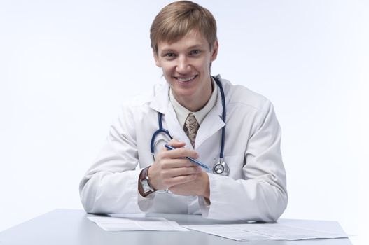 The young doctor in a white dressing gown