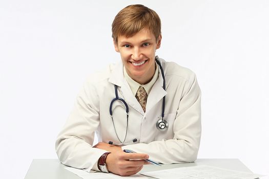 The young doctor in a white dressing gown