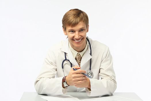 The young doctor in a white dressing gown