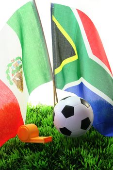 Flags with leather ball and whistle on a white background