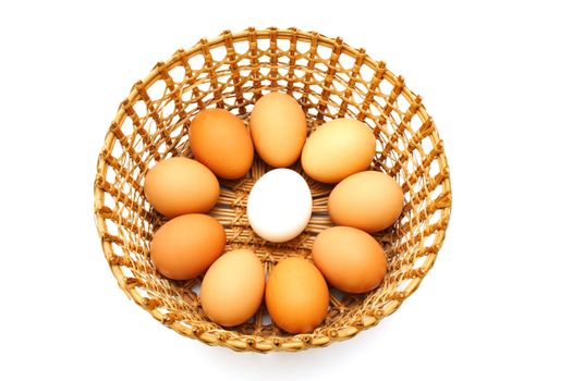 Eggs in the basket isolated on white