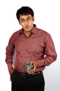 A portrait of a surprised Indian man, on white background.