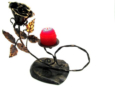 metallic candle with a rose and a candle