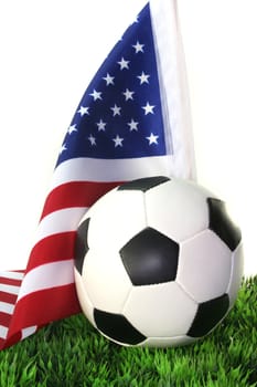 Flag of the United States with football in a field