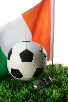 Flag of Ivory Coast with soccer in a field