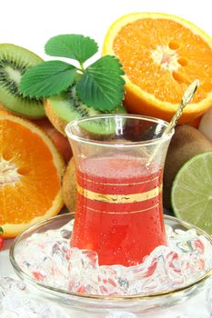 Fruit iced tea with fresh fruit and ice cubes