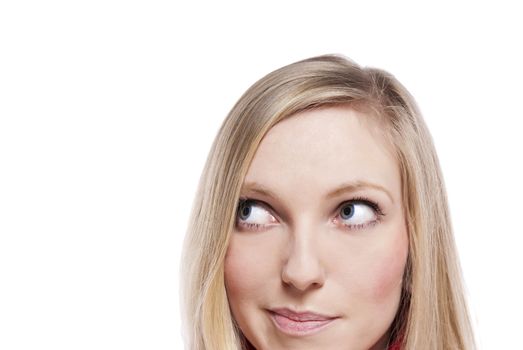 Close-up portrait of a beautiful young woman. Looking up into the corner. Lots of copyspace and room for text on this isolate. 