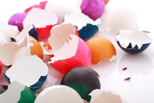 after easter scenario, colorful eggshells on white...........