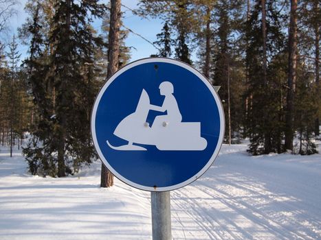 Traffic sign marking a snow route prepared for a snow mobile in Lapland.