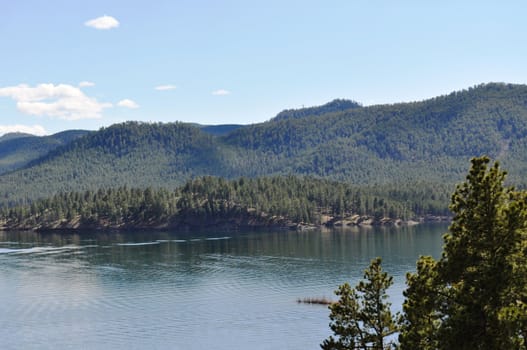 Black hills and water background