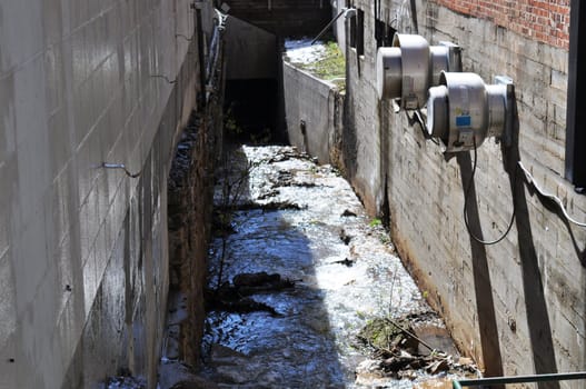 Deadwood stream between buildings