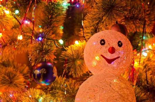 Beautiful Christmas fur-tree decorated with snowman toy