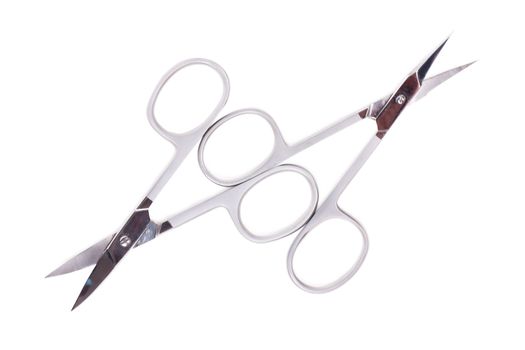Metallic manicure scissors isolated on the white
