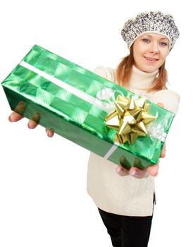 girl in winter hat gives gift box. Studio photography
